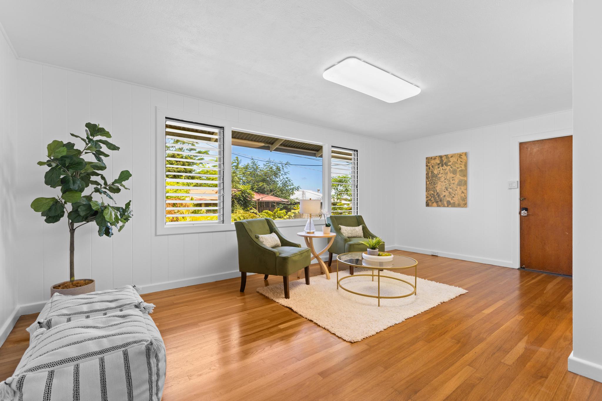 53 Ekaha Street Hilo, HI 96720 - Photo 10 of 29 a living room with furniture and a potted plant