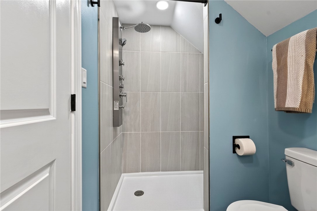 5975 Rosalie Road Dayton, OH 45424 - Photo 26 of 48 This sleek shower and commode area offers contemporary design and essential comfort.