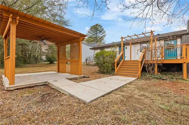 a view of a backyard with a patio