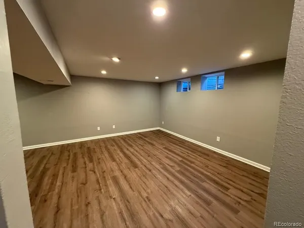 a view of room with wooden floor