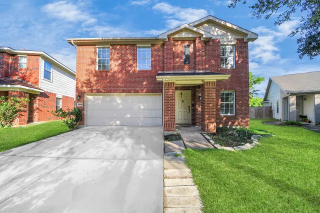 a front view of a building with garden