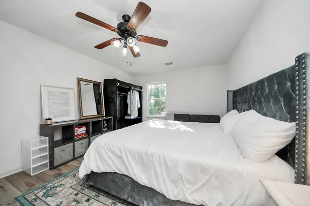 a bed room with a bed and a television