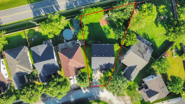 an aerial view of house with yard swimming pool and outdoor seating