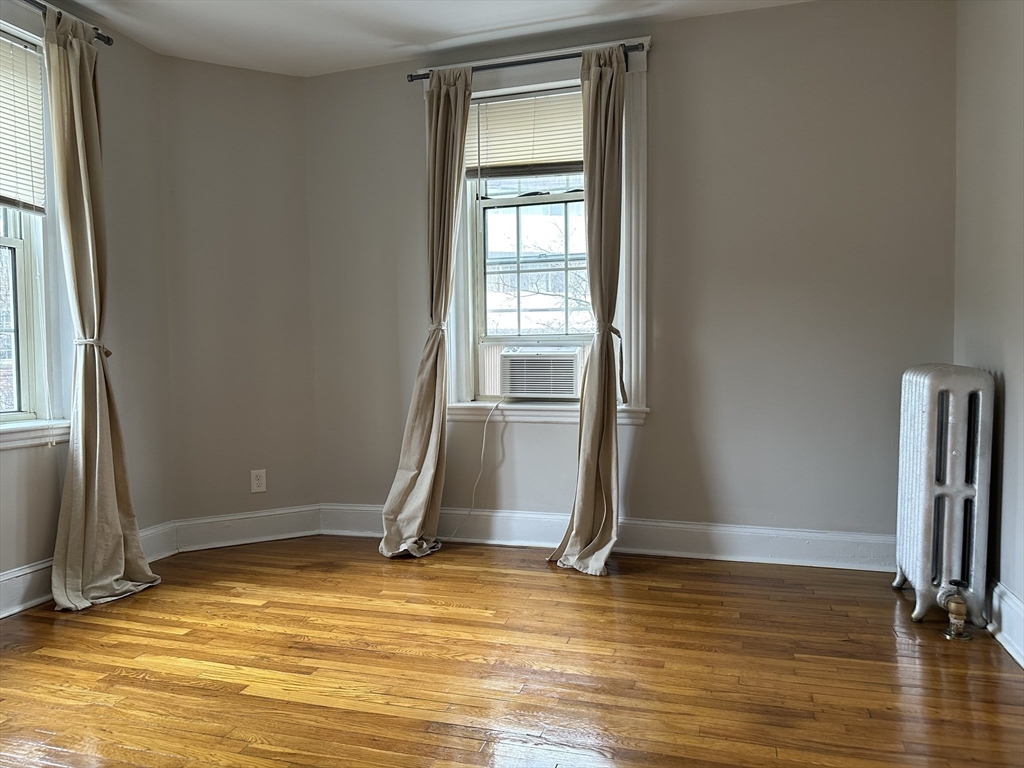 1 Craigie Street, Unit 26 Cambridge, MA 02138 - Photo 17 of 20 a view of a room with wooden floor and a window