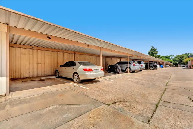 a view of parking space with cars parked