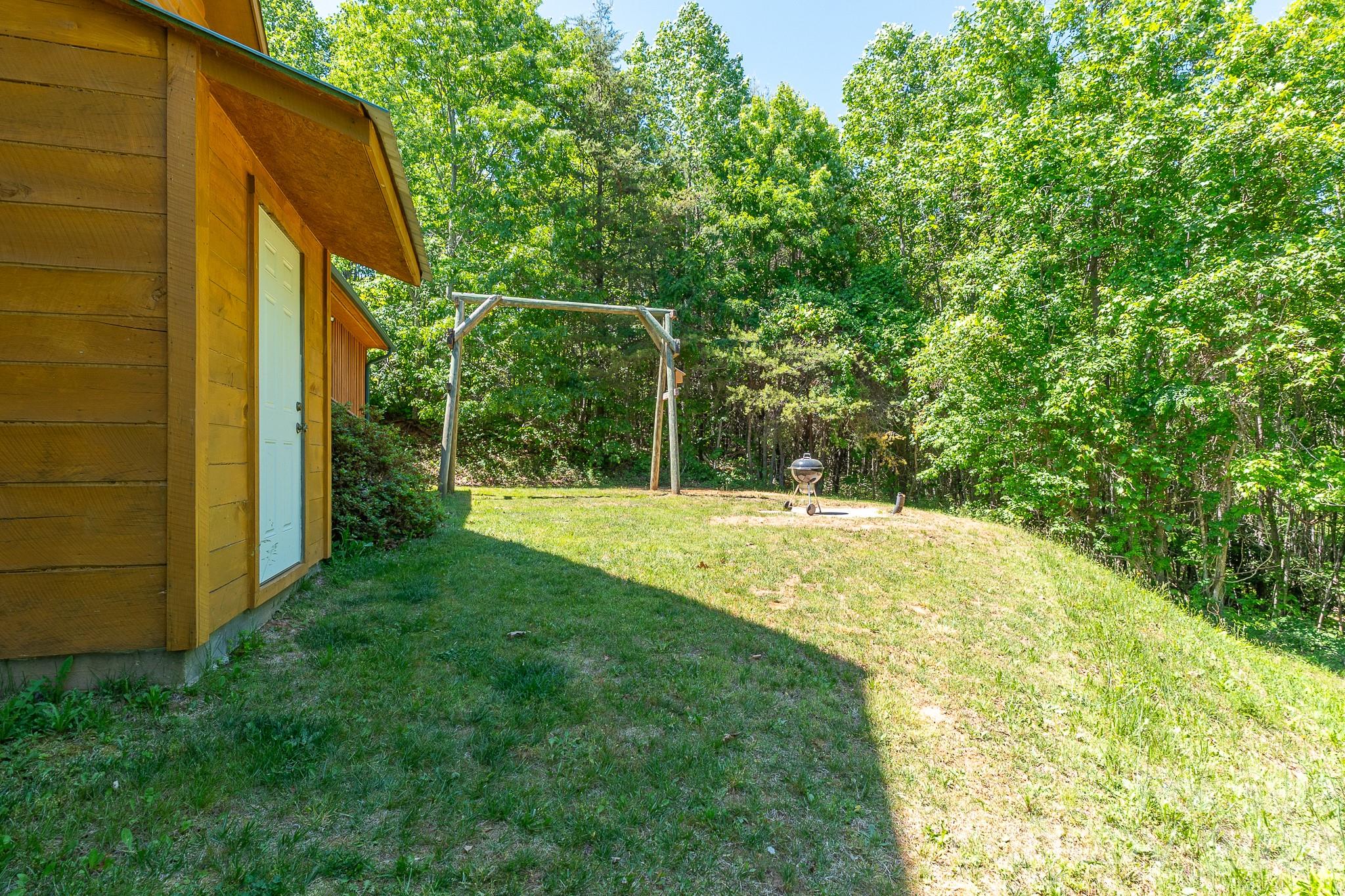 451 Rustic Ridge Drive Canton, NC 28716 - Photo 34 of 44 a view of a backyard with basketball court
