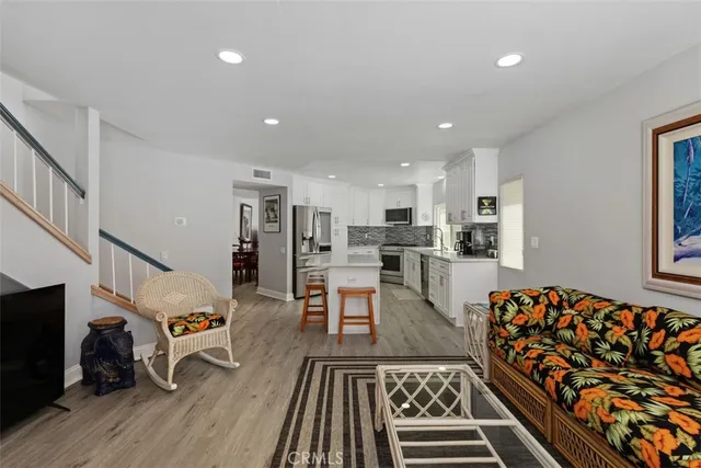 a living room with furniture and a rug