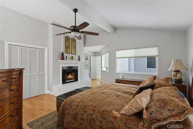 a bedroom with a bed and a fireplace