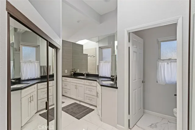 a kitchen with stainless steel appliances a refrigerator and cabinets