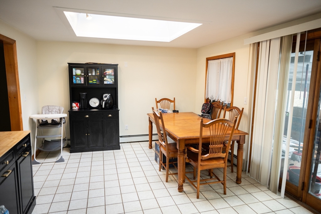 10 Chris Road Oxford, MA 01540 - Photo 16 of 42 a dining room with furniture and wooden floor