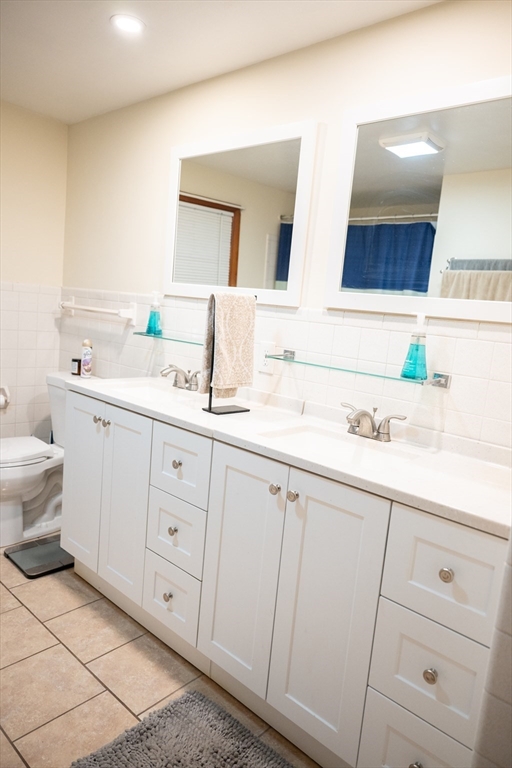 10 Chris Road Oxford, MA 01540 - Photo 21 of 42 a bathroom with a sink a toilet and mirror