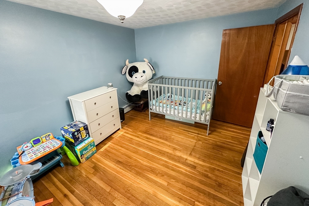 10 Chris Road Oxford, MA 01540 - Photo 24 of 42 a bedroom with baby bed and a window