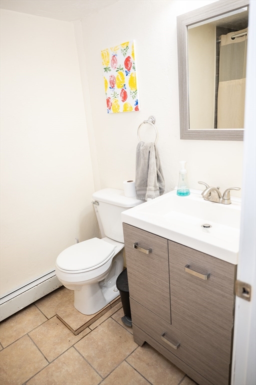 10 Chris Road Oxford, MA 01540 - Photo 28 of 42 a bathroom with a sink mirror and toilet
