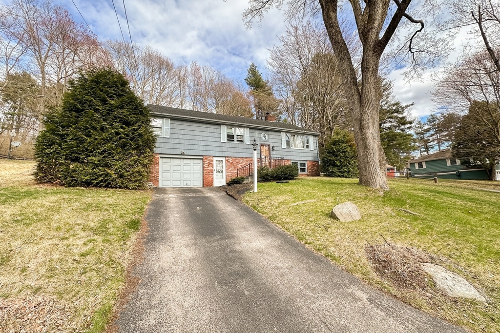 10 Chris Road Oxford, MA 01540 - Photo 38 of 42 a view of a house with backyard and tree