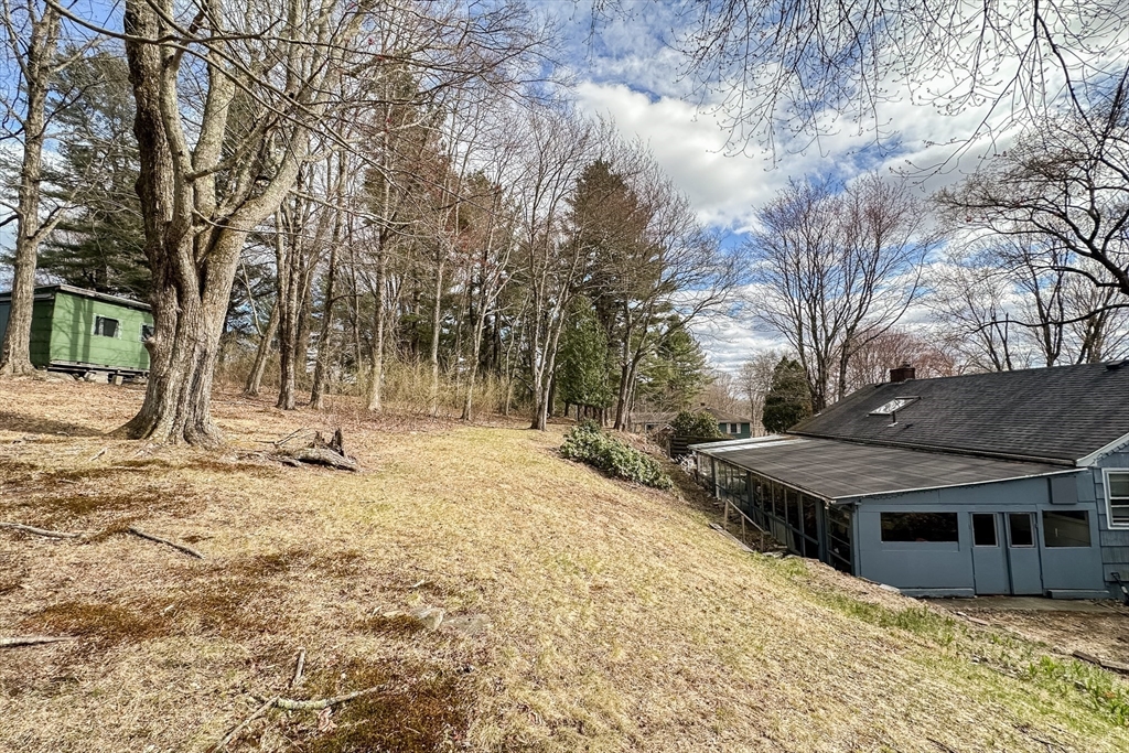 10 Chris Road Oxford, MA 01540 - Photo 41 of 42 a backyard of a house with large trees