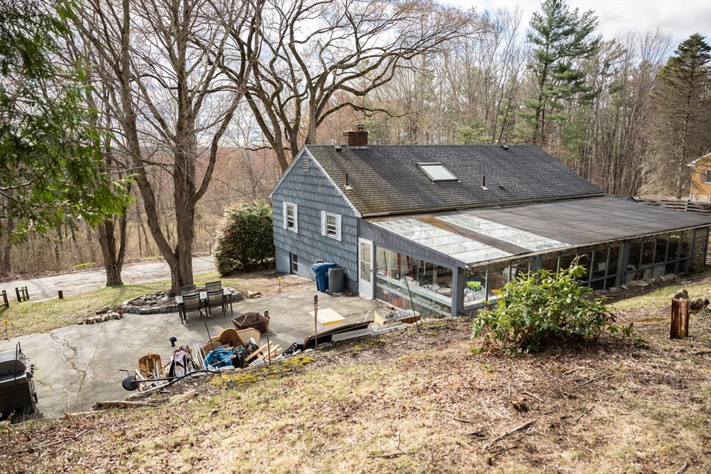 10 Chris Road Oxford, MA 01540 - Photo 6 of 42 a view of a patio with a table and chairs under an umbrella