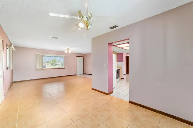 a kitchen with a sink a cabinets and window