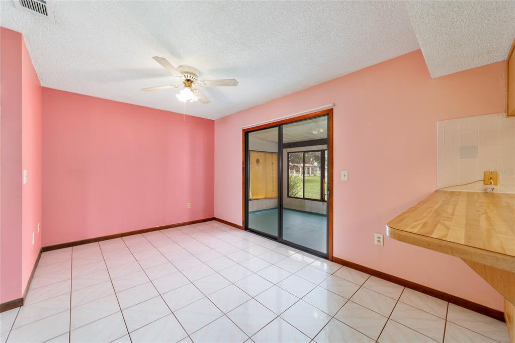 9841 Southwest 102nd Place Ocala, FL 34481 - Photo 30 of 66 a view of an empty room with window and cabinet area