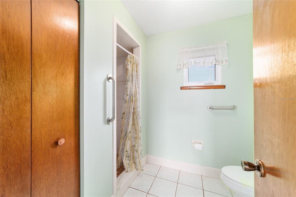 9841 Southwest 102nd Place Ocala, FL 34481 - Photo 40 of 66 a bathroom with a shower and a toilet
