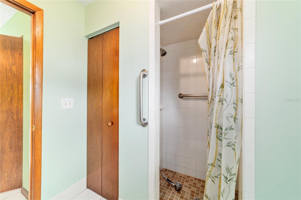 9841 Southwest 102nd Place Ocala, FL 34481 - Photo 41 of 66 a bathroom with a glass shower door