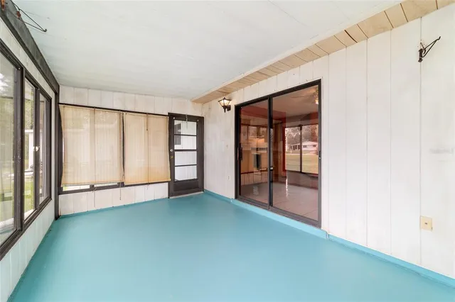 a view of a house with swimming pool and a yard