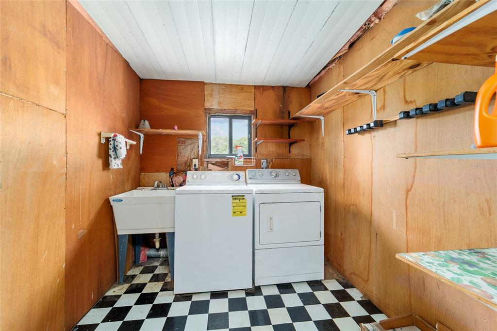 9841 Southwest 102nd Place Ocala, FL 34481 - Photo 52 of 66 a utility room with dryer and washer