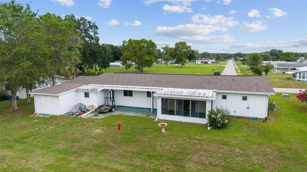 9841 Southwest 102nd Place Ocala, FL 34481 - Photo 57 of 66 a aerial view of a house with pool and a yard