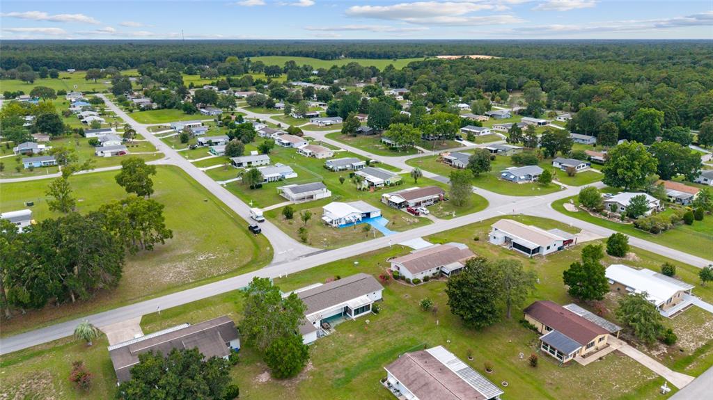 9841 Southwest 102nd Place Ocala, FL 34481 - Photo 60 of 66 an aerial view of residential houses with outdoor space