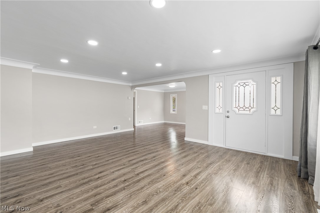 10876 West Sprague Road Cleveland, OH 44130 - Photo 4 of 31 Foyer featuring a wealth of natural light, crown molding, and hardwood / wood-style flooring