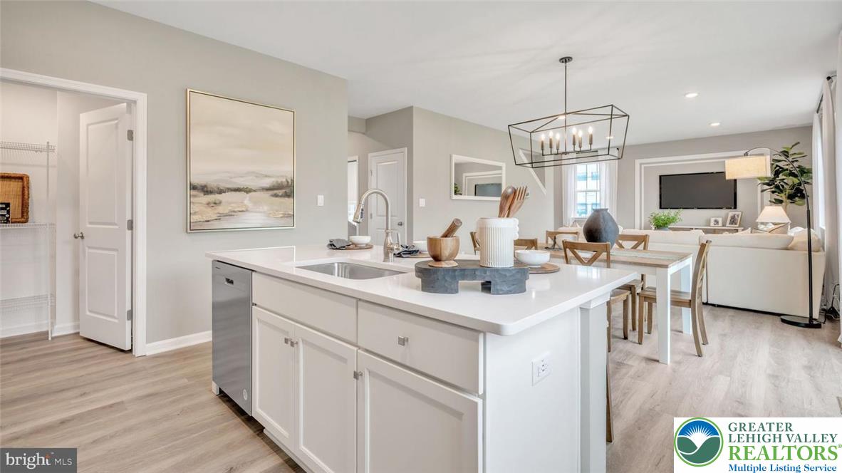 115 Winding Road Easton, PA 18040 - Photo 19 of 24 This open-concept living space features a functional kitchen island and seamless flow into the dining and living areas.