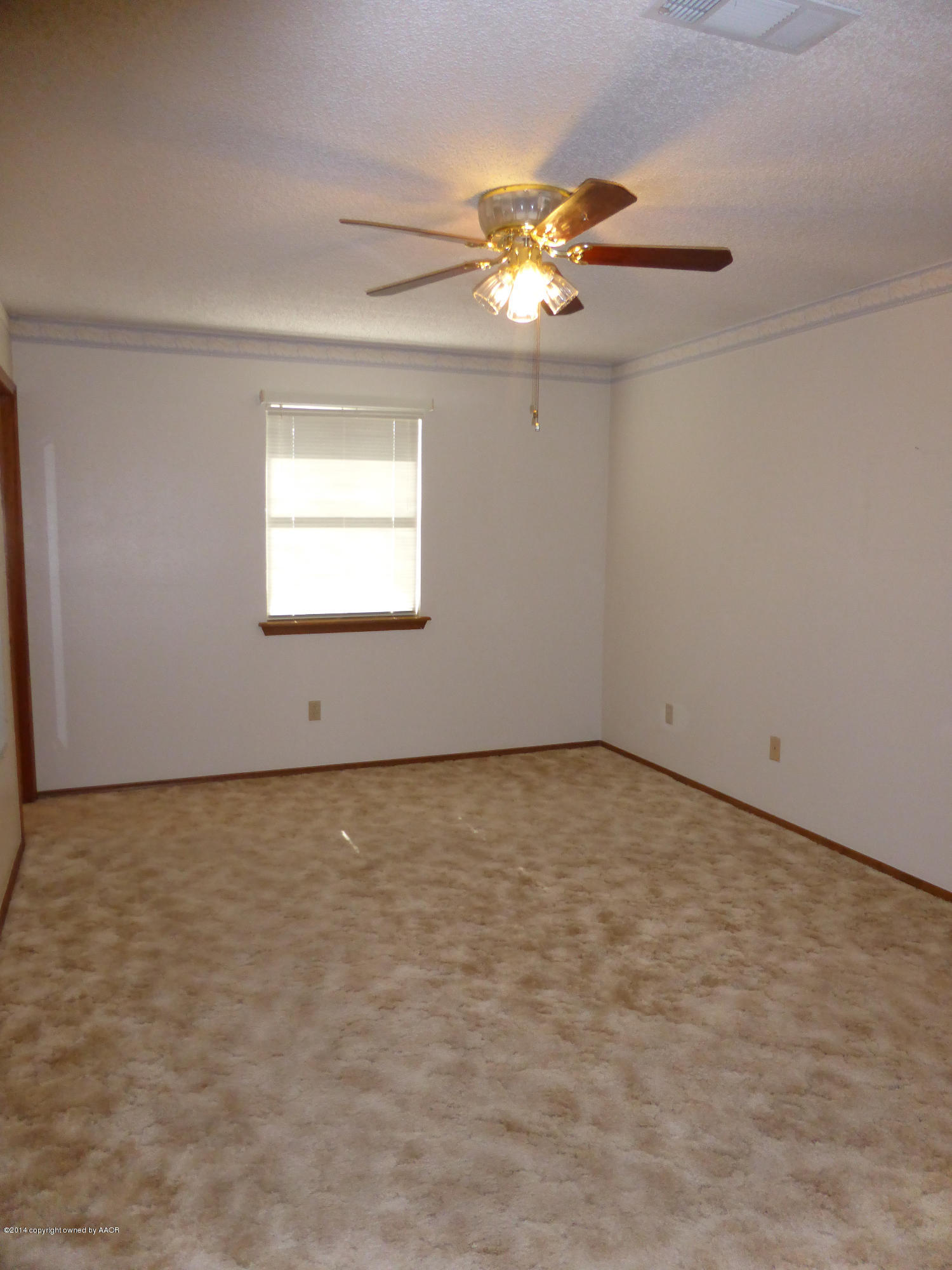 8112 Marni Trail Amarillo, TX 79110 - Photo 11 of 22 an empty room with a chandelier fan