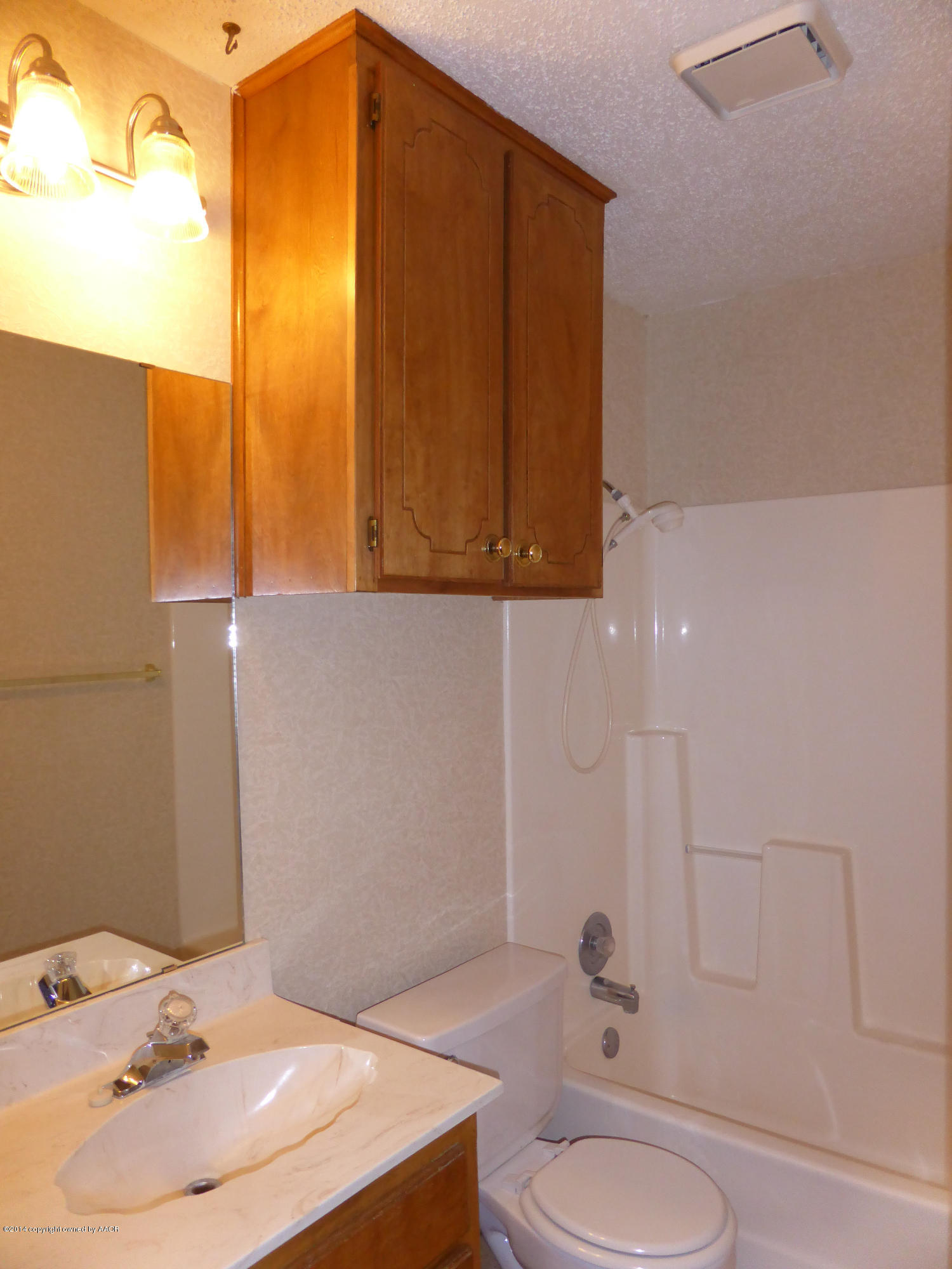 8112 Marni Trail Amarillo, TX 79110 - Photo 15 of 22 a bathroom with a sink toilet and shower