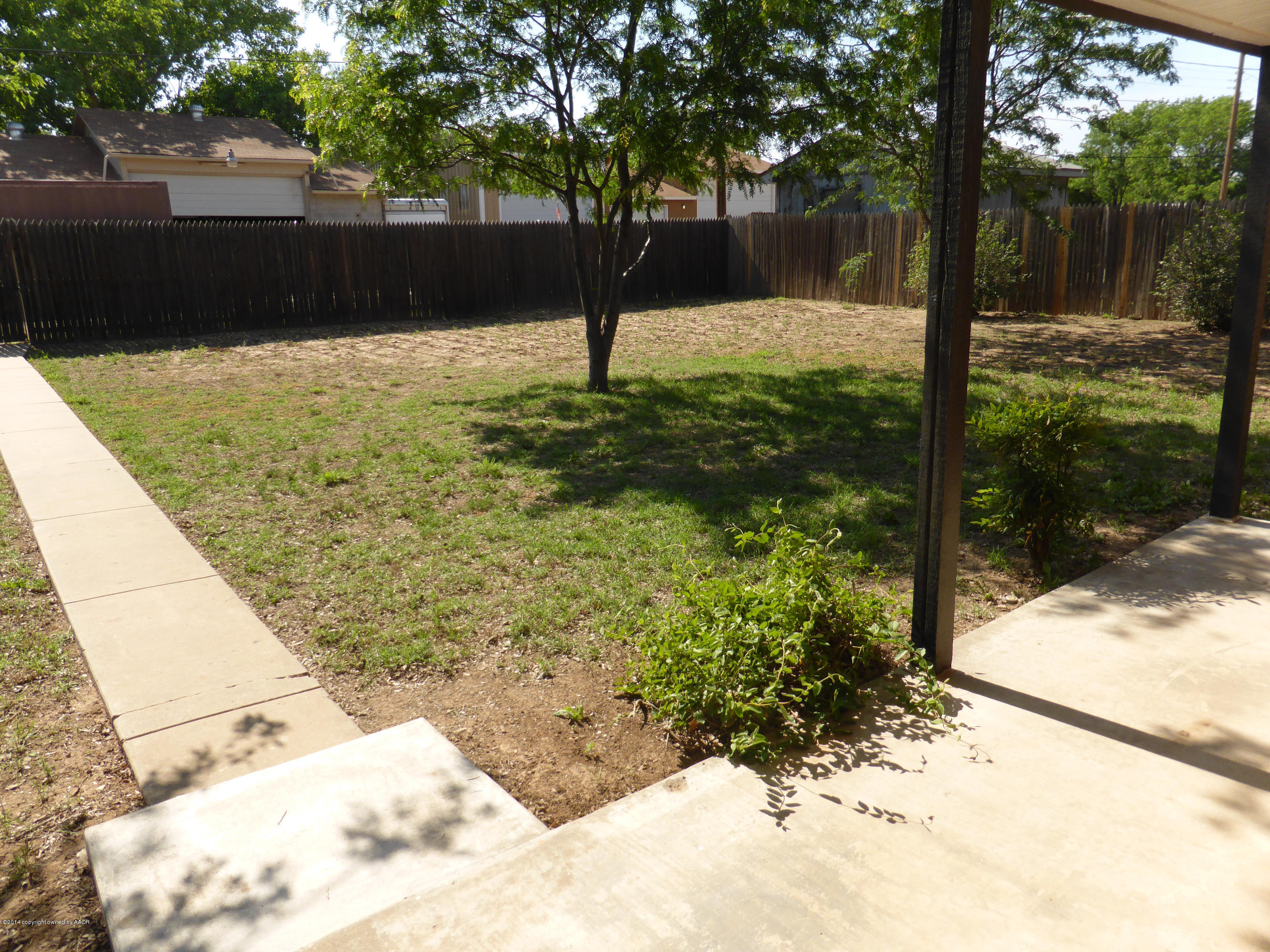 8112 Marni Trail Amarillo, TX 79110 - Photo 2 of 22 a view of a yard with plants