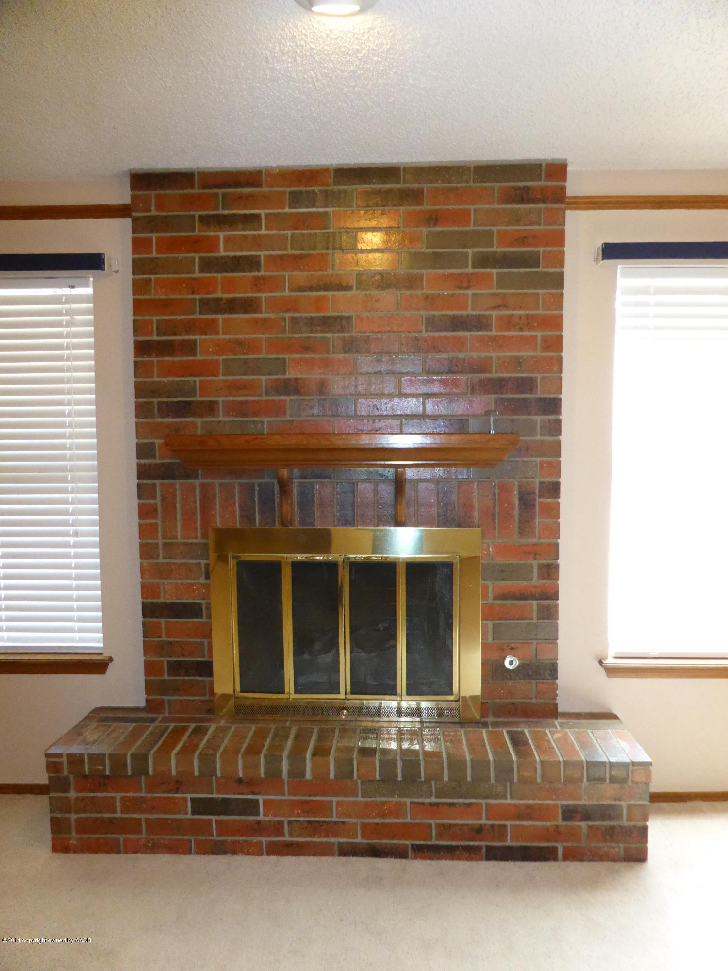 8112 Marni Trail Amarillo, TX 79110 - Photo 7 of 22 a view of fireplace and window