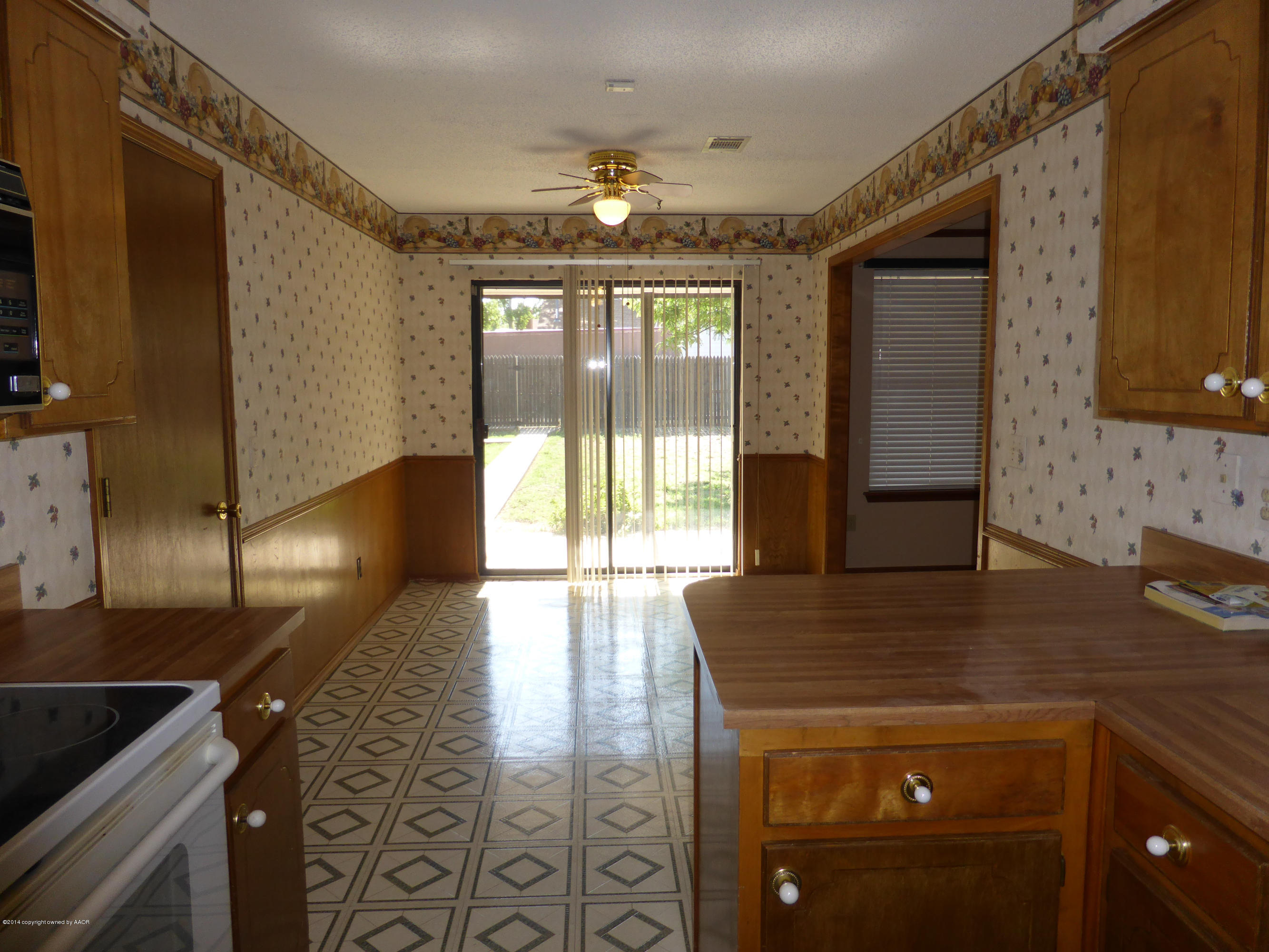 8112 Marni Trail Amarillo, TX 79110 - Photo 8 of 22 a view of a kitchen with a sink and a large window