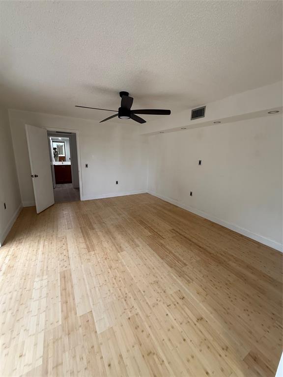 9138 Southwest 23rd Street, Unit B Davie, FL 33324 - Photo 19 of 21 a view of a room with wooden floor and windows