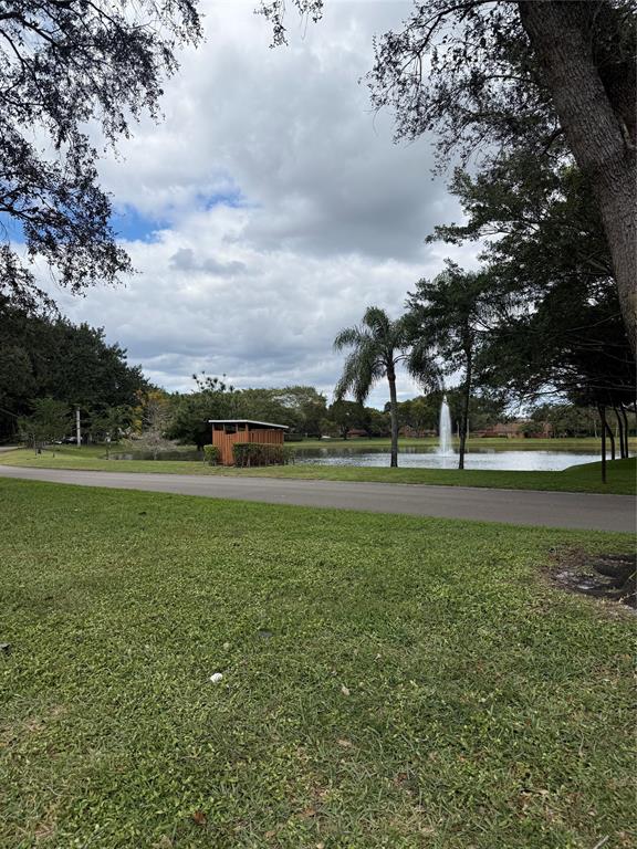 9138 Southwest 23rd Street, Unit B Davie, FL 33324 - Photo 21 of 21 a view of green field with trees