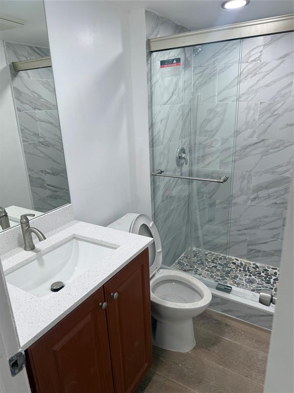 9138 Southwest 23rd Street, Unit B Davie, FL 33324 - Photo 6 of 21 a bathroom with a sink a toilet and shower