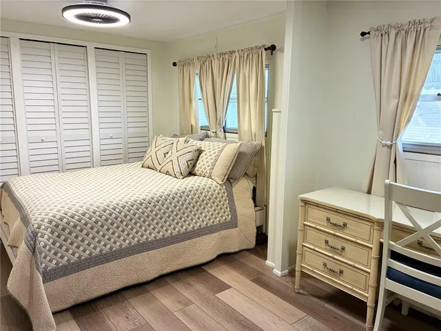 a bedroom with a bed and a dresser
