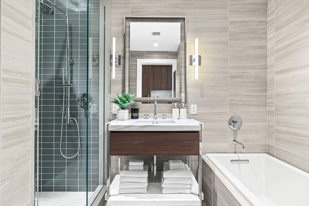 40 Trinity Place, Unit 1604 Boston, MA 02116 - Photo 13 of 38 a bathroom with a sink and a bathtub