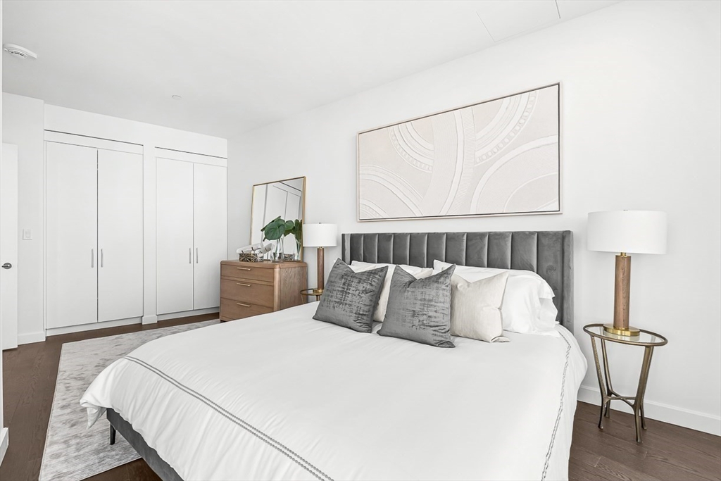 40 Trinity Place, Unit 1604 Boston, MA 02116 - Photo 6 of 38 a bedroom with a bed and a table