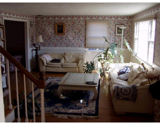 8 Angela Street Canton, MA 02021 - Photo 4 of 5 a living room with furniture and a fireplace
