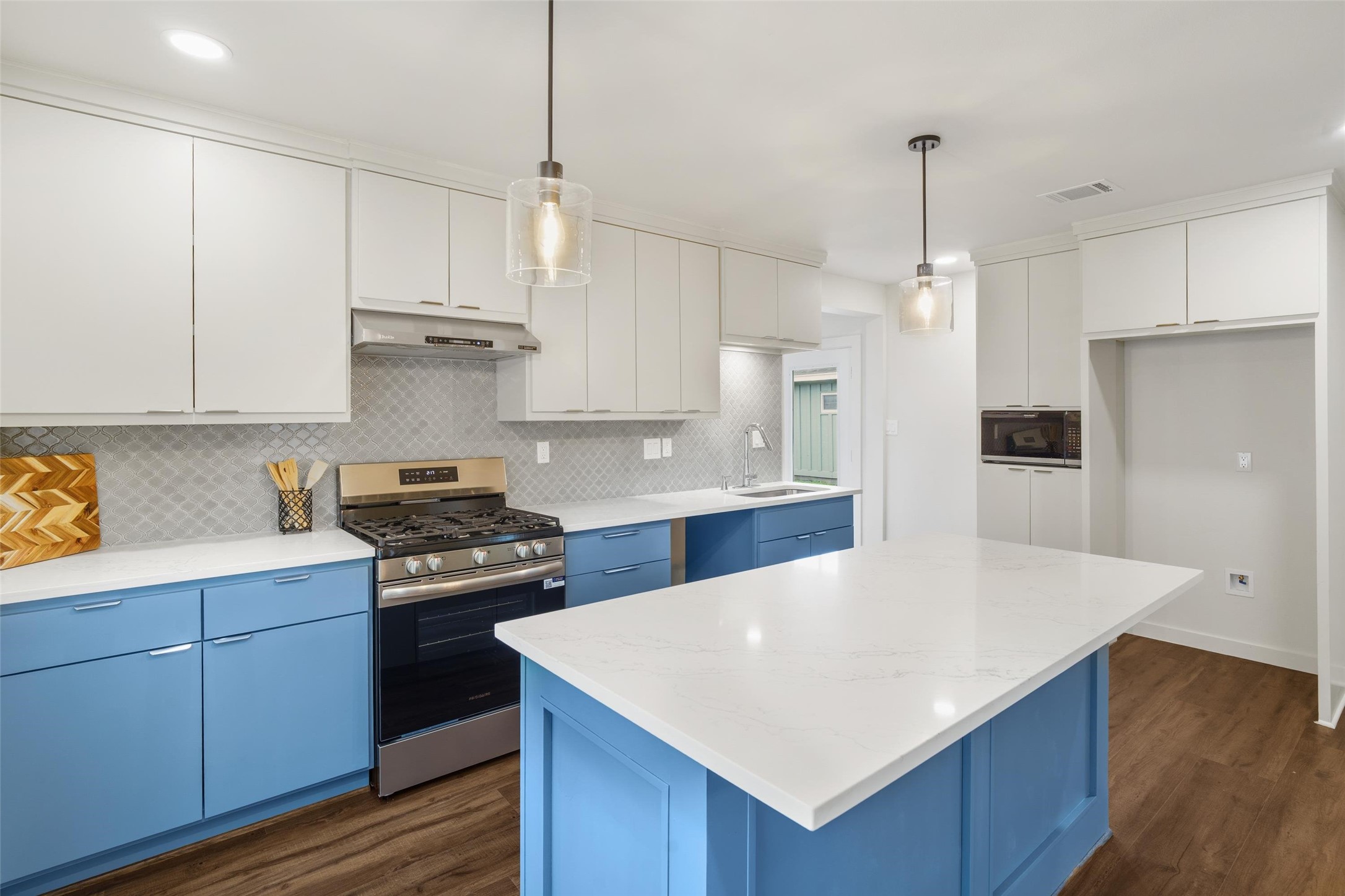 1801 Harding Street Pasadena, TX 77502 - Photo 11 of 22 a kitchen with kitchen island a sink stainless steel appliances and cabinets