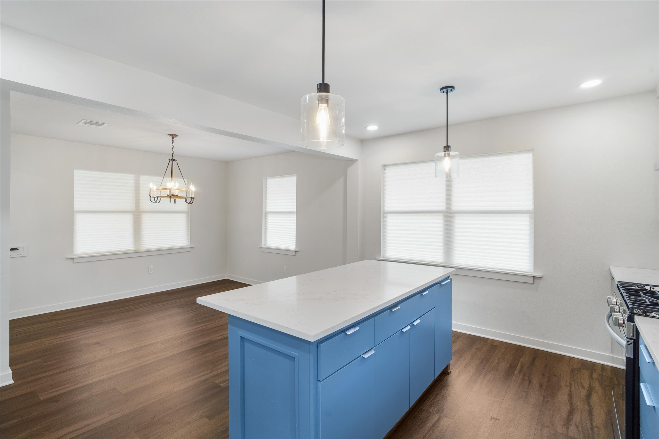 1801 Harding Street Pasadena, TX 77502 - Photo 12 of 22 a kitchen with a sink chandelier and wooden floor