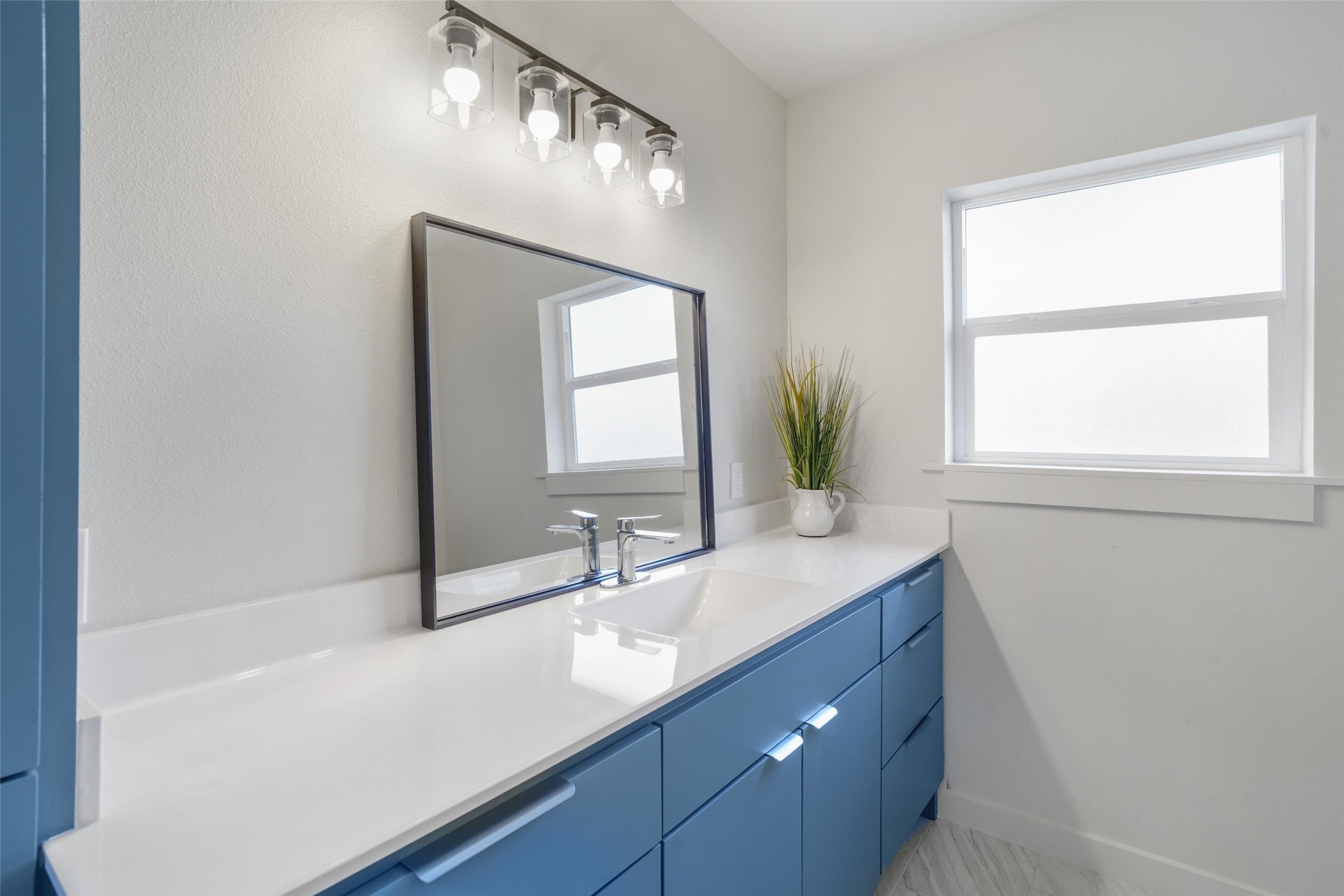 1801 Harding Street Pasadena, TX 77502 - Photo 17 of 22 a bathroom with a sink and a mirror