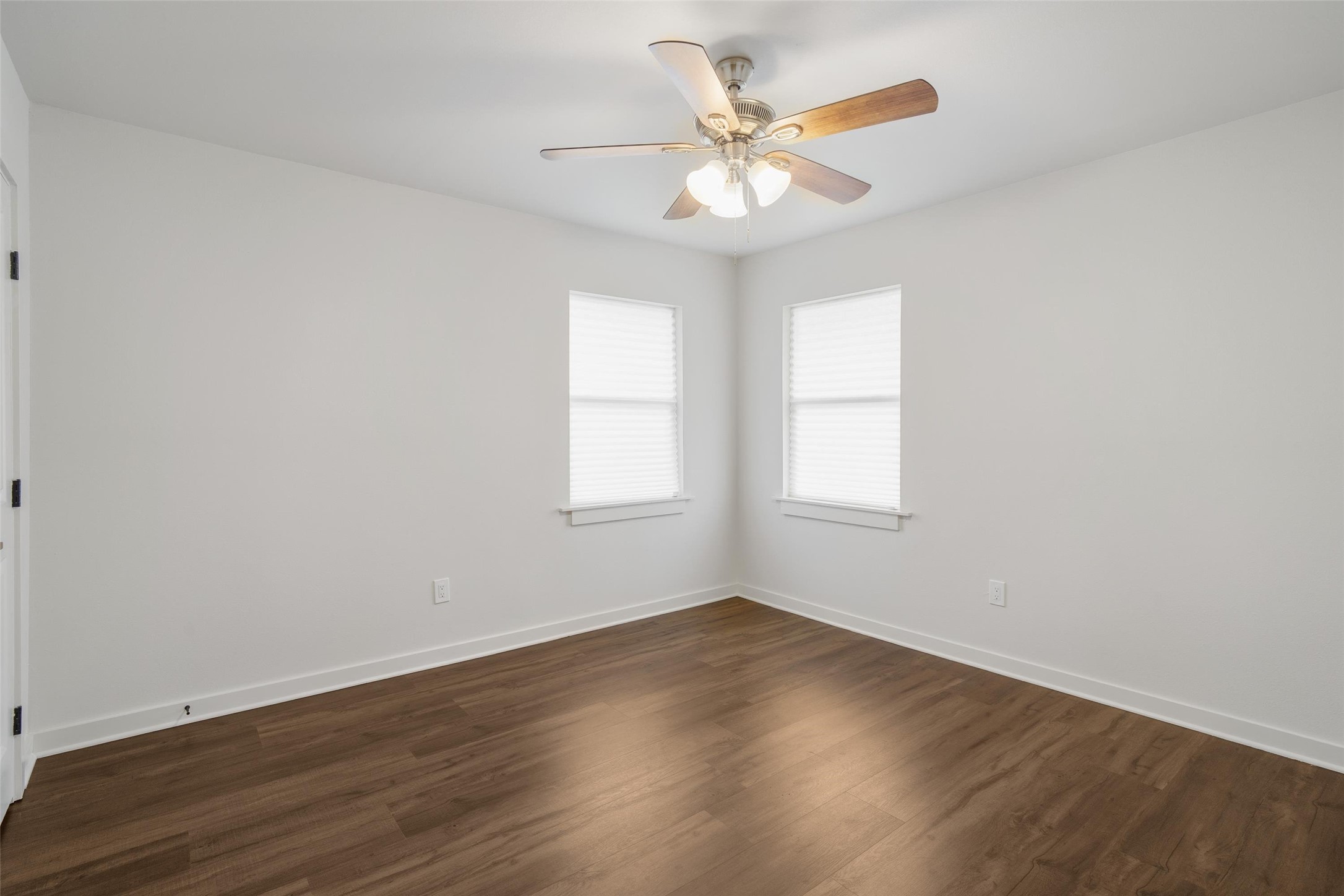 1801 Harding Street Pasadena, TX 77502 - Photo 18 of 22 an empty room with wooden floor and windows