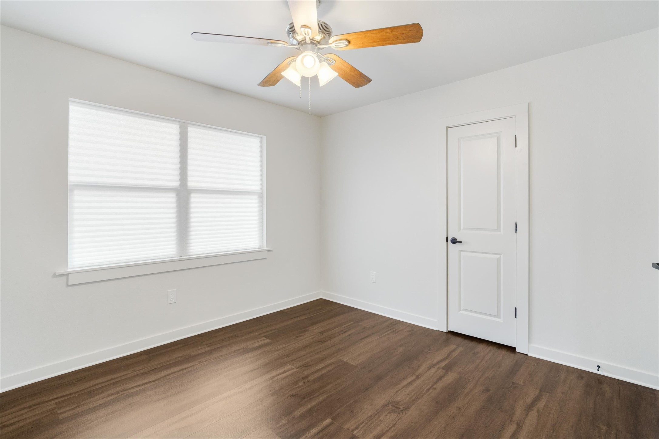 1801 Harding Street Pasadena, TX 77502 - Photo 21 of 22 wooden floor in an empty room with a window
