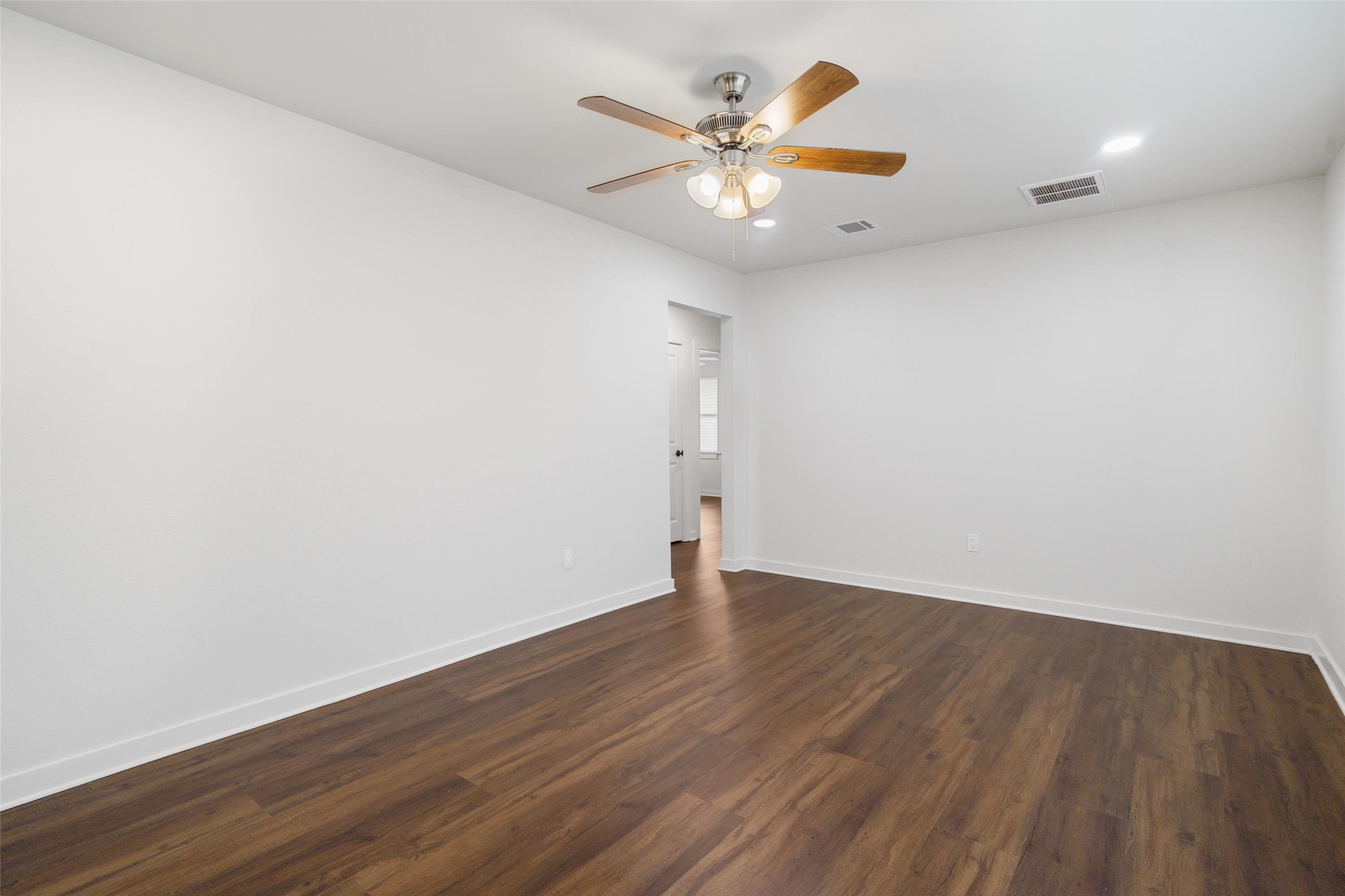 1801 Harding Street Pasadena, TX 77502 - Photo 6 of 22 an empty room with wooden floor and windows