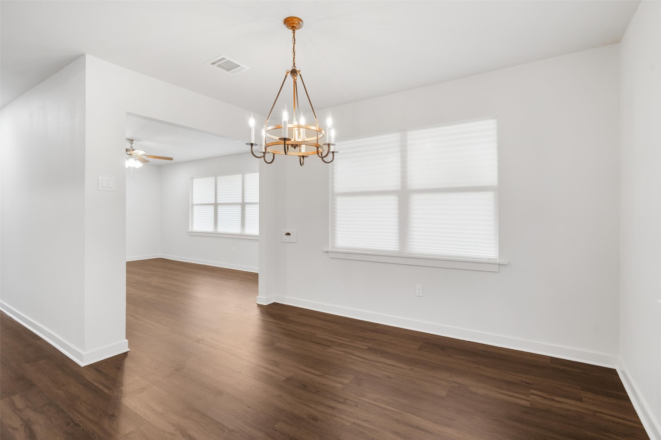 1801 Harding Street Pasadena, TX 77502 - Photo 8 of 22 a view of a livingroom with wooden floor a chandelier