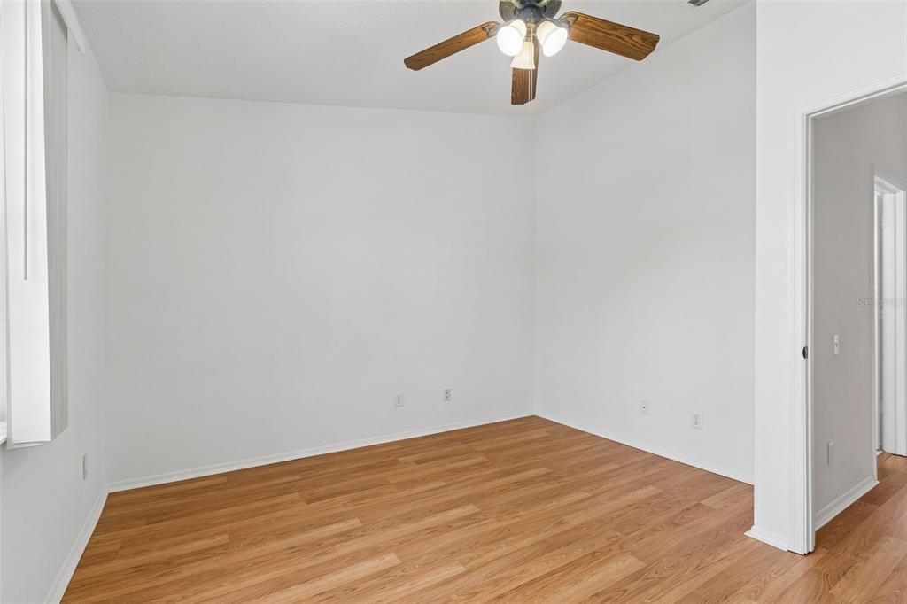 382 Countryside Key Boulevard Oldsmar, FL 34677 - Photo 27 of 58 an empty room with a chandelier fan
